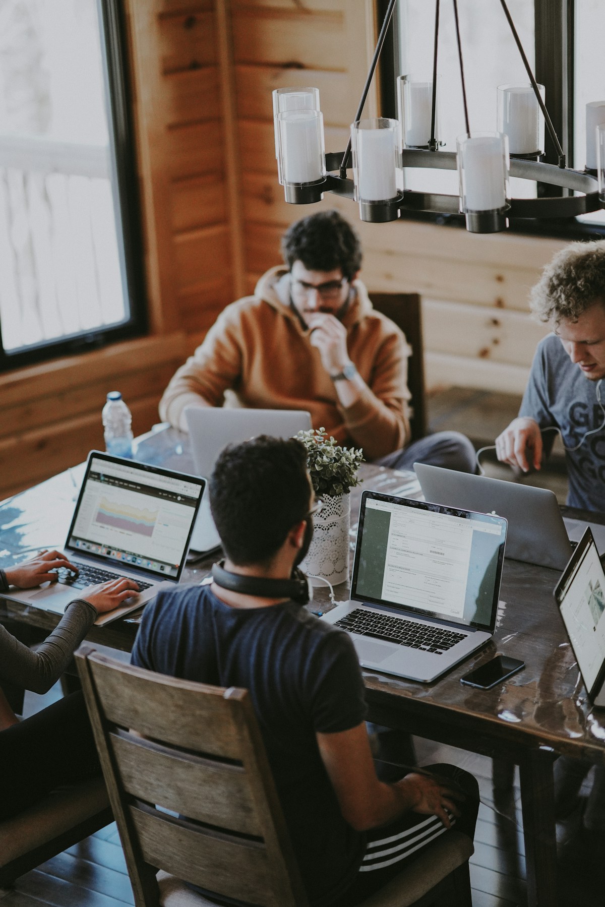 Professionals collaborating around technology in a bright modern workspace